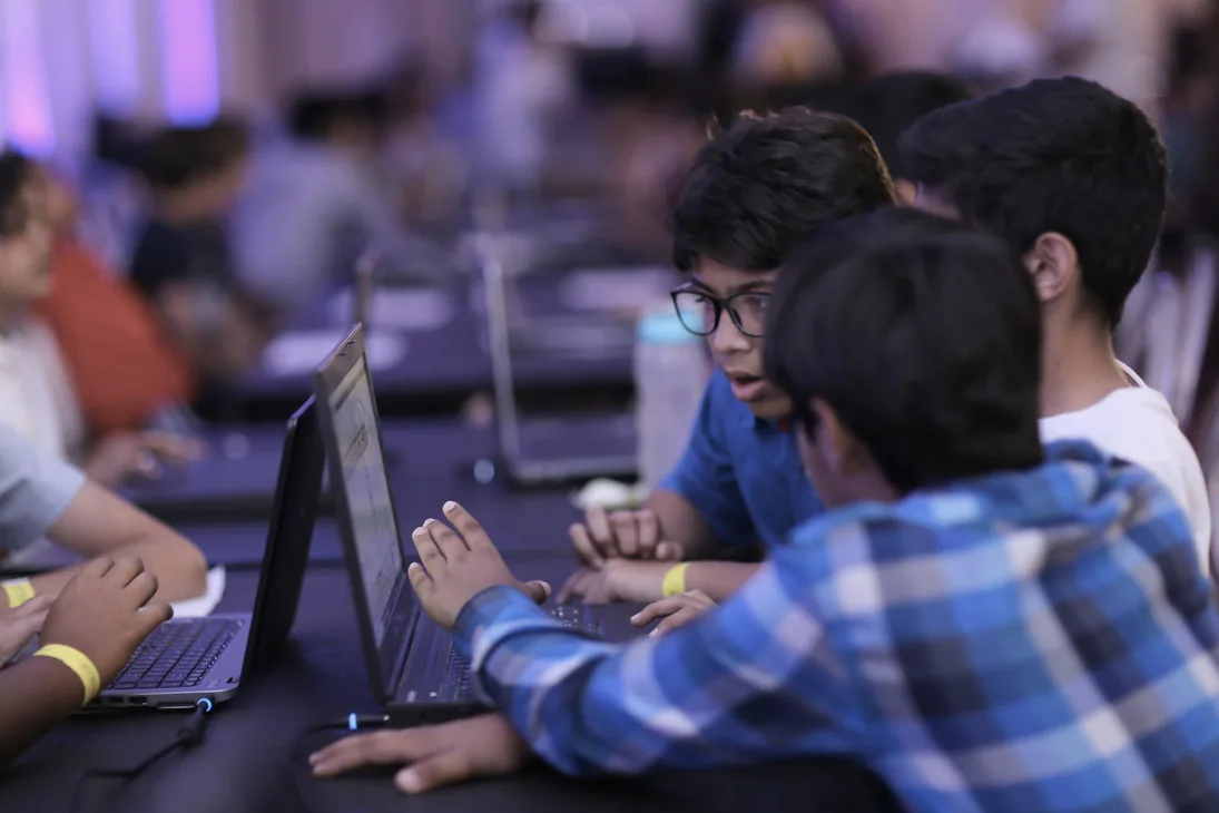 Students coding and testing an educational robot