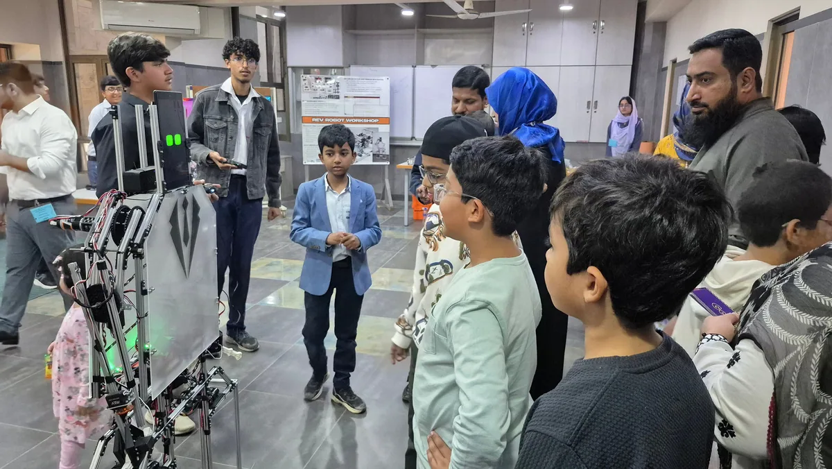 An instructor guiding students through a STEM activity